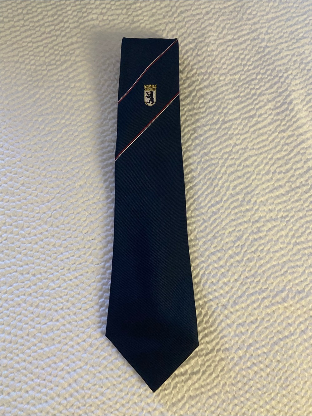 Navy Tie with Red Accent Stripe and Crest